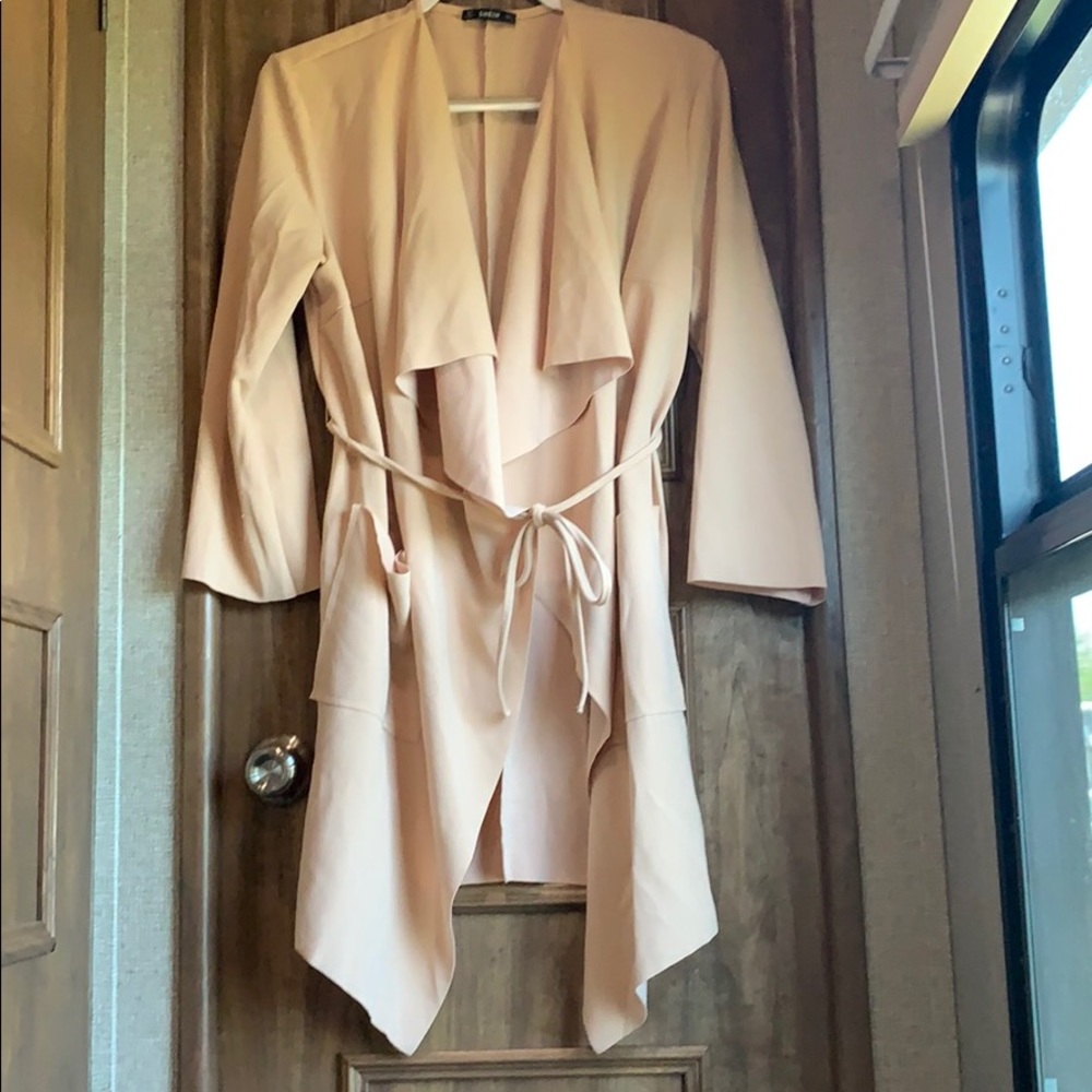 Fashion coat, ruffle and waist tie.